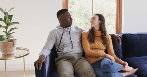 Happy Diverse Couple Enjoying Comfortable Home Moment