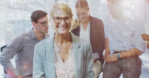 Smiling Business Team Discussing Financial Data Insights
