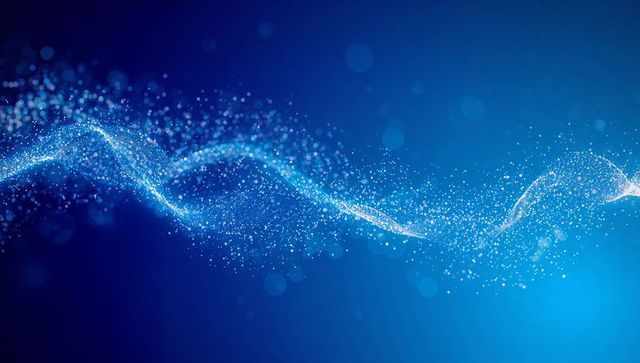 Glowing particle wave on blue background with bokeh highlights