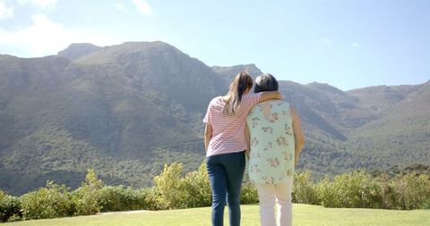 Granddaughter Embracing Grandmother Enjoying Scenic Mountain View - Download Free Stock Images Pikwizard.com