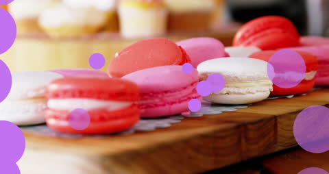 Elegant Christmas Macarons on Wooden Board with Festive Dots