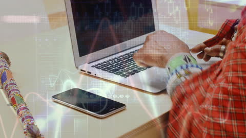 African Man Engaging with Technological Connections on Laptop