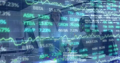 Two Businesswomen Analyzing Stock Market Data in Modern Office