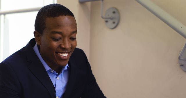 Smiling Businessman Wearing Suit in Office Setting - Download Free Stock Images Pikwizard.com