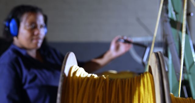 Middle-Aged Woman Using Traditional Loom for Textile Weaving - Download Free Stock Images Pikwizard.com