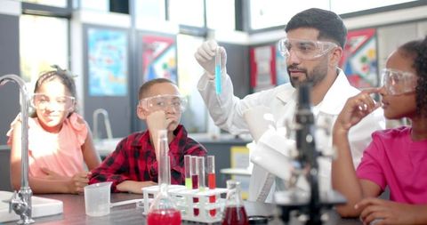 Science Teacher Engaging Curious Students in Chemistry Experiment - Download Free Stock Images Pikwizard.com