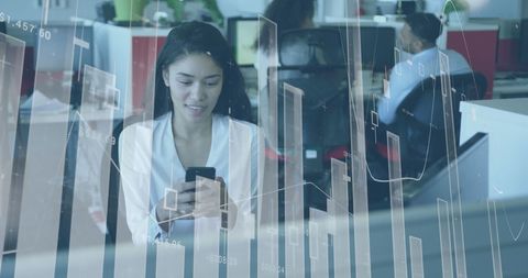 Businesswoman Engaging with Mobile App in Modern Office