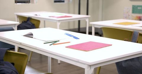 Clean and Organized Study Space in Classroom with Stationery