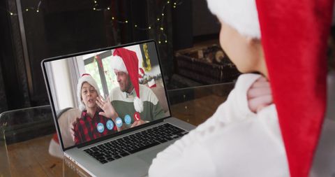 Girl with Santa Hat Video Calling Family During Christmas Celebrations