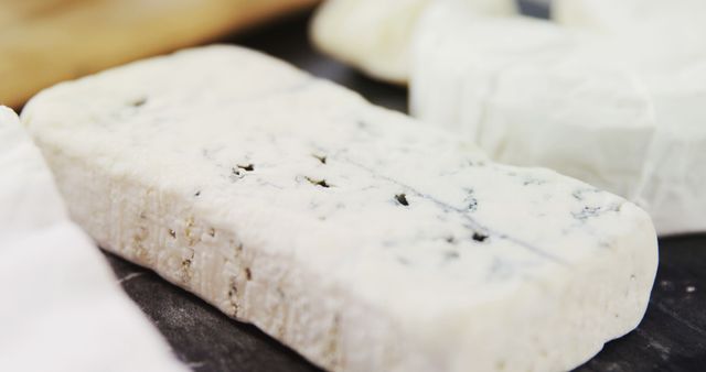 Ideal for advertising gourmet food products or culinary blogs. This image highlights the texture and appeal of blue cheese, making it perfect for menus, food articles, or social media promotions aimed at food lovers.