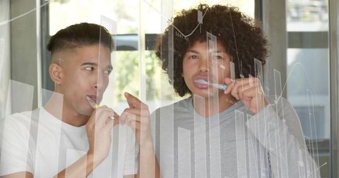 Young Men Brushing Teeth Together at Mirror with Financial Chart Overlay Morning Routine