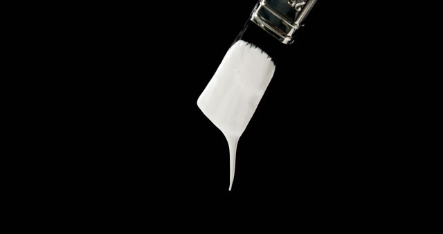 Close-Up of Paintbrush with Dripping White Paint on Black Background - Download Free Stock Photos Pikwizard.com
