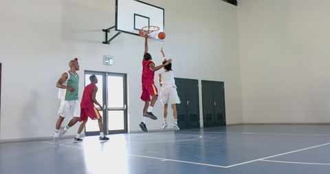 Youthful Energetic Basketball Slam Dunk Gym Action - Download Free Stock Images Pikwizard.com