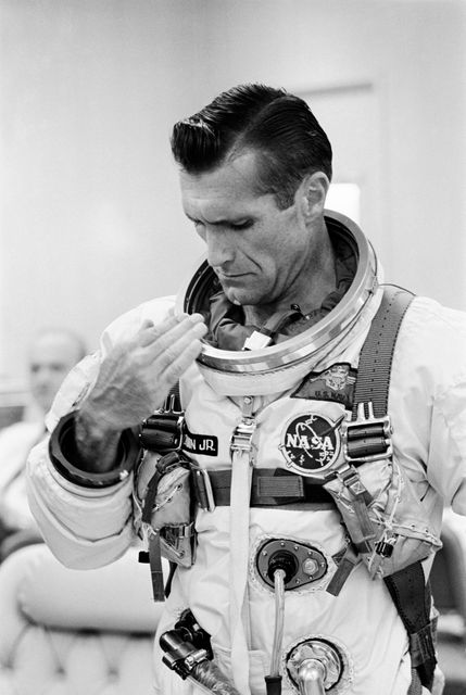This image shows astronaut Richard F. Gordon Jr. preparing for the Gemini-11 mission on September 12, 1966. His focused gaze reflects the intensity of pre-launch preparations. Ideal for illustrating historical milestones in space exploration, aerospace technology, and astronaut training. Perfect for educational material, documentaries, and space-related exhibitions.