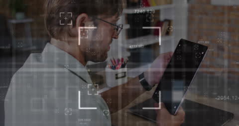 Professional Man Analyzing Data on Digital Tablet