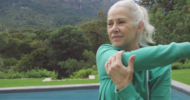 Senior Woman Exercising Outdoors by the Pool - Download Free Stock Images Pikwizard.com