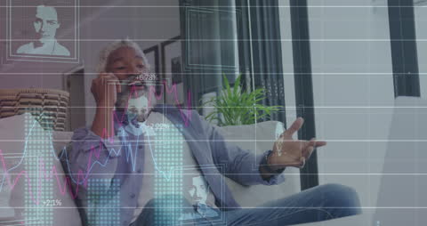 Businessman Analyzing Financial Data on Phone with Graphs Overlay