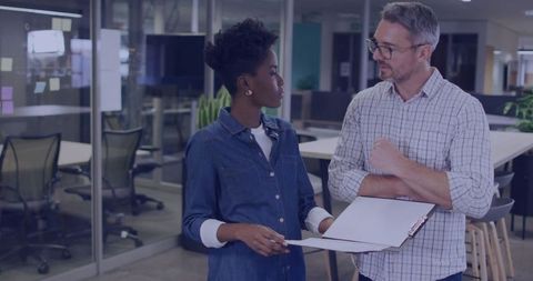 Business Colleagues Discussing Project Details in Modern Office