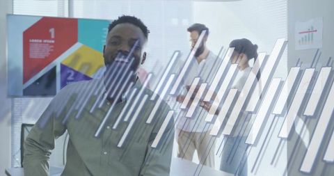 Businessman presenting interactive analytics at corporate meeting