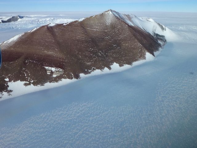 Pensacola Mountains near the Foundation Ice Stream, which Operation IceBridge surveyed on Oct. 28.   Credit: NASA / Maria-Jose Vinas  NASA's Operation IceBridge is an airborne science mission to study Earth's polar ice. For more information about IceBridge, visit: <a href="http://www.nasa.gov/icebridge" rel="nofollow">www.nasa.gov/icebridge</a>  <b><a href="http://www.nasa.gov/audience/formedia/features/MP_Photo_Guidelines.html" rel="nofollow">NASA image use policy.</a></b>  <b><a href="http://www.nasa.gov/centers/goddard/home/index.html" rel="nofollow">NASA Goddard Space Flight Center</a></b> enables NASA’s mission through four scientific endeavors: Earth Science, Heliophysics, Solar System Exploration, and Astrophysics. Goddard plays a leading role in NASA’s accomplishments by contributing compelling scientific knowledge to advance the Agency’s mission.  <b>Follow us on <a href="http://twitter.com/NASA_GoddardPix" rel="nofollow">Twitter</a></b>  <b>Like us on <a href="http://www.facebook.com/pages/Greenbelt-MD/NASA-Goddard/395013845897?ref=tsd" rel="nofollow">Facebook</a></b>  <b>Find us on <a href="http://instagrid.me/nasagoddard/?vm=grid" rel="nofollow">Instagram</a></b>