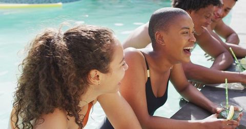 Diverse Friends Enjoying Refreshing Drinks by Pool