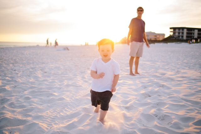 Father and Son Enjoying Sunset Beachtime Stroll - Download Free Stock Photos Pikwizard.com