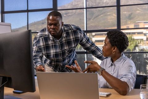 Focused Colleagues Working on Project in Modern Office Setting
