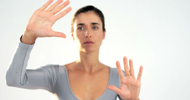 Young Woman Practicing Hand Movements in Bright Studio - Download Free Stock Images Pikwizard.com