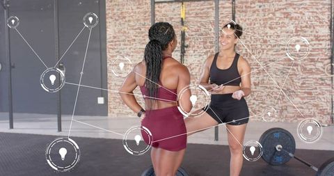 Trainer Coaching Athlete in Industrial Gym During Strength and Weightlifting Session