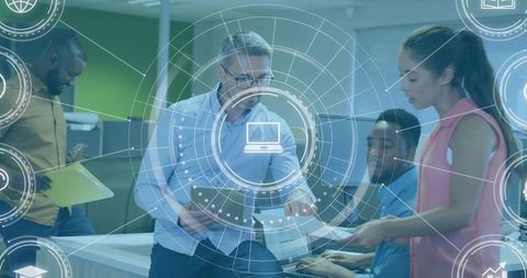Senior Manager Guiding Diverse Team at Workstation with Digital HUD and Collaborative Tech
