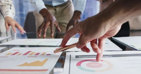 Business Professionals Analyzing Charts During Meeting