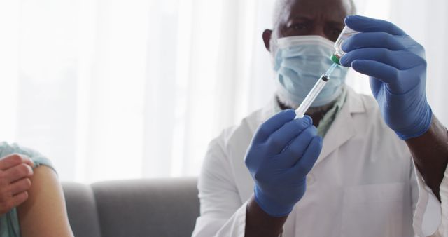 Healthcare professional preparing vaccine for patient - Download Free Stock Images Pikwizard.com