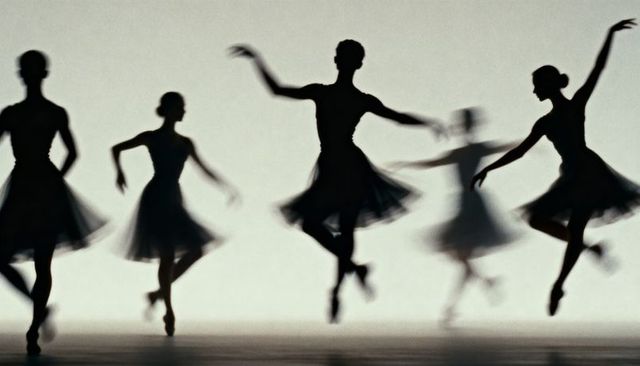 Leaping ballet ensemble creating layered silhouettes in backlit minimalist choreography