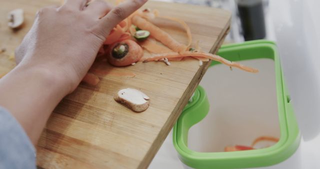 Hand Discarding Vegetable Peelings Into Green Food Waste Bin - Download Free Stock Images Pikwizard.com