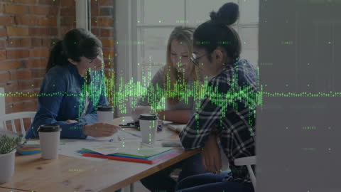 Young Colleagues Analyzing Digital Financial Data Overlaid Graphs