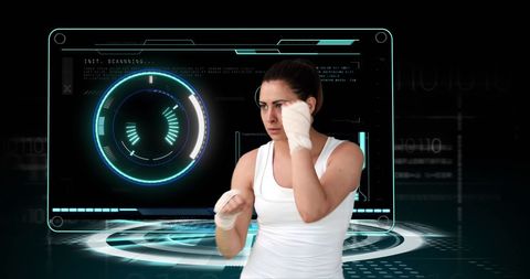 Female boxer training with futuristic digital interface