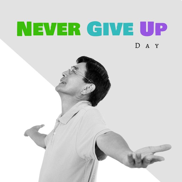 Smiling mature Asian man with arms outstretched represents positivity and encouragement for Never Give Up Day. Suitable for use in motivational campaigns, social media postings, personal development promotions, and inspirational content. The black and white contrast with colorful text adds a visually appealing aesthetic, symbolizing hope and perseverance.