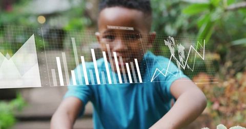Young Boy Interacting with Digital Financial Visuals Outdoors