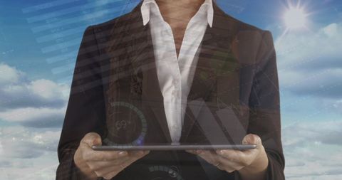 Businesswoman Using Digital Tablet for Financial Analytics in Cloud Environment