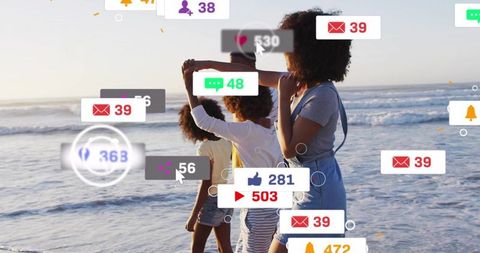 Family walking on sunlit beach at golden hour with floating social media notifications