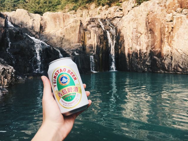 Person Holding Beer Can in Front of Waterfall - Download Free Stock Images Pikwizard.com