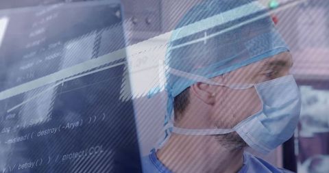 Surgeon analyzing surgical monitor with code overlay representing digital healthtech