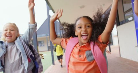 Schoolchildren Joyfully Running with Backpacks in School Corridor - Download Free Stock Images Pikwizard.com