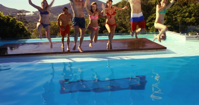 Group of Friends Jumping into Swimming Pool on Vacation - Download Free Stock Images Pikwizard.com