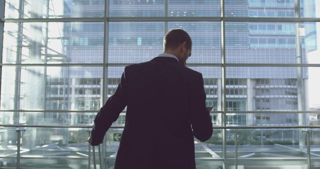 Businessman Looking Out at Modern Office Building - Download Free Stock Images Pikwizard.com