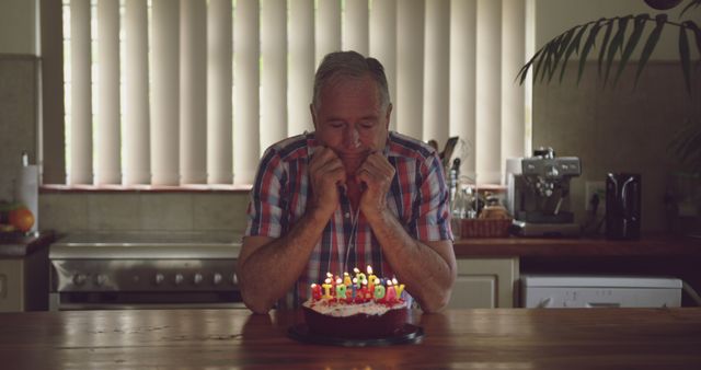 Elderly Man Reflecting on Birthday Alone in Kitchen - Download Free Stock Photos Pikwizard.com