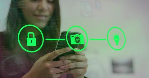 Holding smartphone and tapping app with green padlock, camera, lightbulb holographic icons
