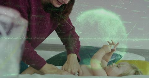 Male caregiver bonding with newborn on bed surrounded by digital health data overlay