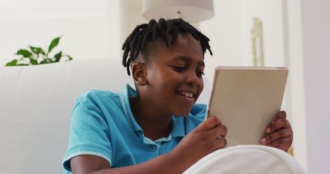 Happy Boy Using Tablet at Home - Download Free Stock Images Pikwizard.com