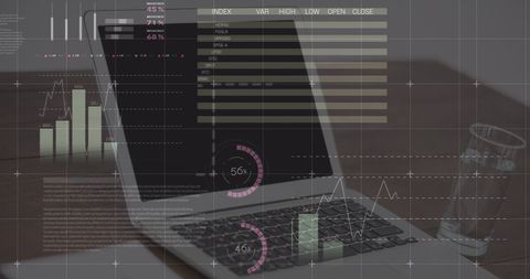 Laptop with Financial Graphs and Data Overlays on Desktop - Download Free Stock Images Pikwizard.com